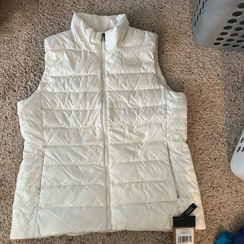 North face white puffy zip up vest. Size L